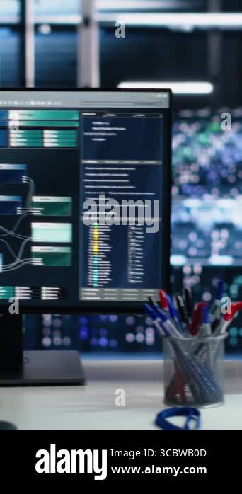 Vertical video Server room PC screens tracking mainframes processing ...