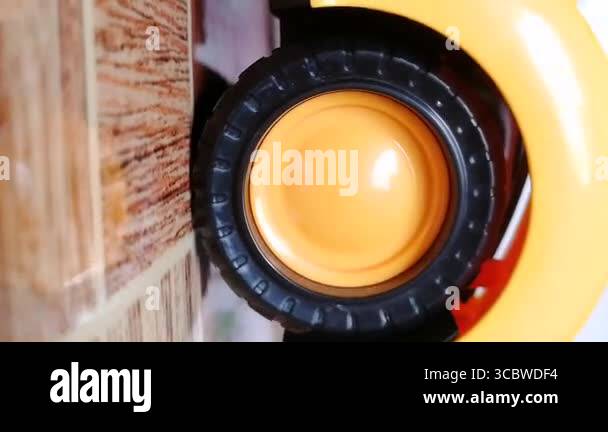 Car wheel spinning. Black tire with yellow rim rolling slowly. Best ...