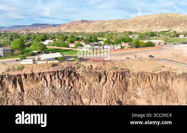 Aerial tracking shot glides above a dramatic cliff edge in Hurricane ...