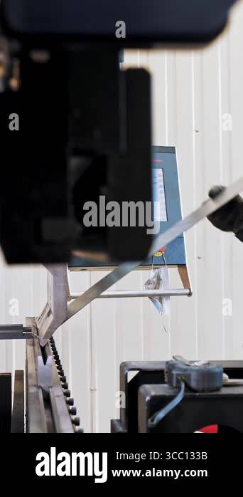 bending of sheet metal. A bending machine operator places and bens ...