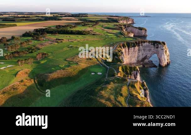 Experience the breathtaking aerial perspective of Etretats white chalk ...