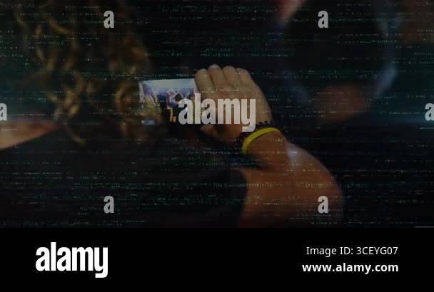 Man raising smartphone over friend capturing stage silhouette and