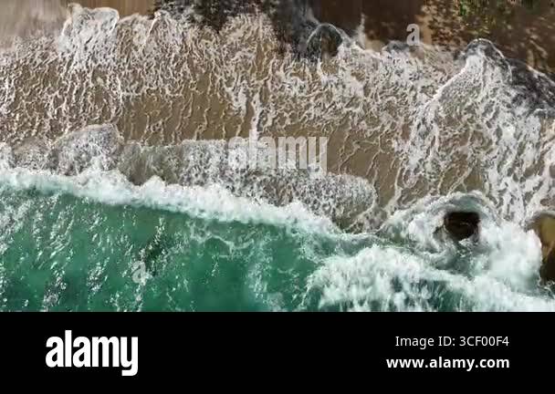 Giant ocean waves crashing and foaming on empty sand tropical beach ...