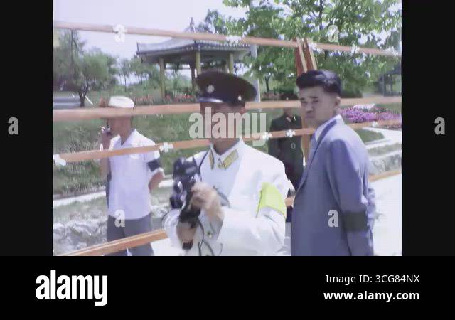 PANMUNJOM - 1968 - A North Korean officer wearing a white uniform takes ...
