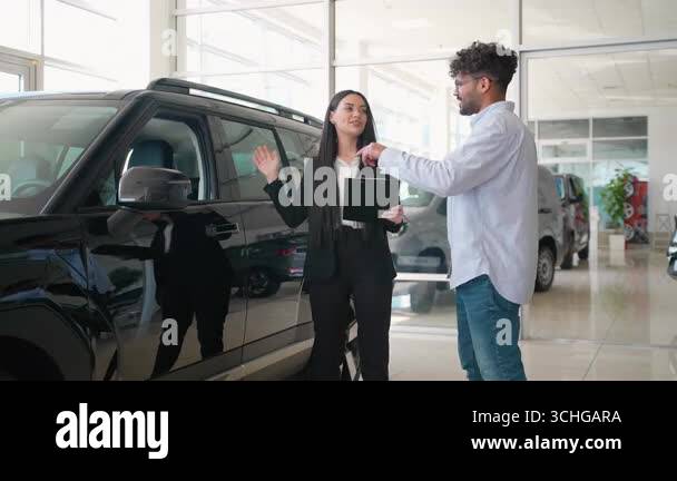 A car dealership's financial advisor explaining the benefits of in-house car financing to a customer