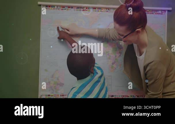 Teacher guiding student hand at world map while digital swirls ...