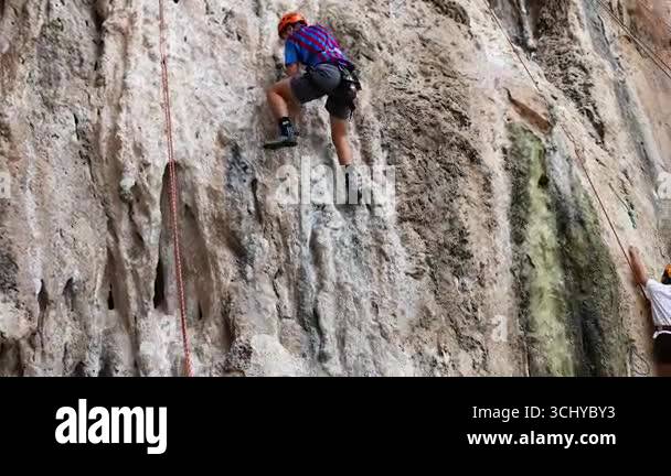 Climber ascends rocky cliff safety Stock Videos & Footage - HD and 4K ...