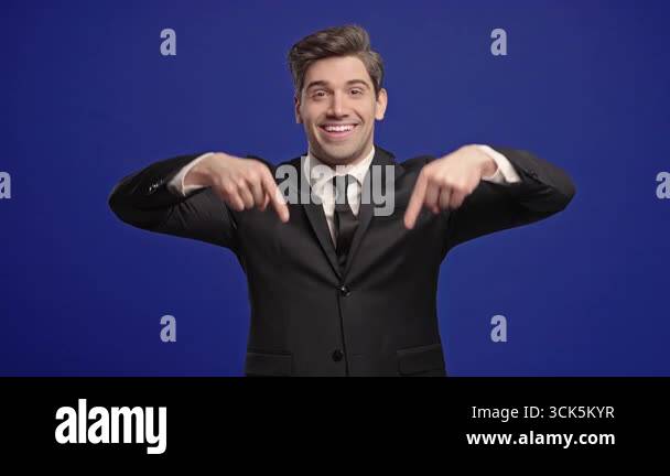 Businessman Points Both Index Fingers Downward To Indicate Area Below ...