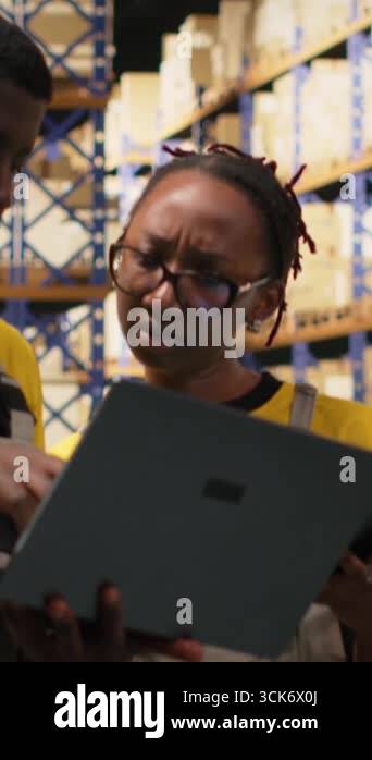 Vertical Video Large business warehouse staff handling order ...
