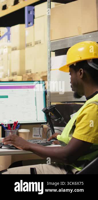 Vertical Video Black staff member using a barcode scanner to process ...