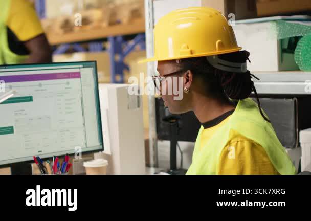 African american female verifying the shipment details on awb labels ...