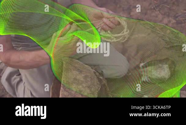 Man kneeling in forest unfolding rope, with animated guides showing ...