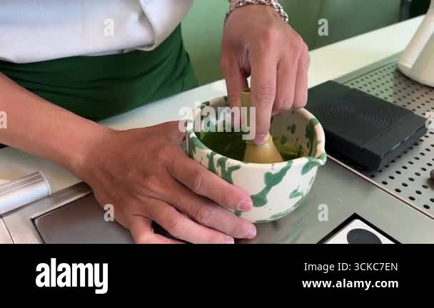 Whisking matcha tea traditional Japanese style bowl for brewing fresh ...