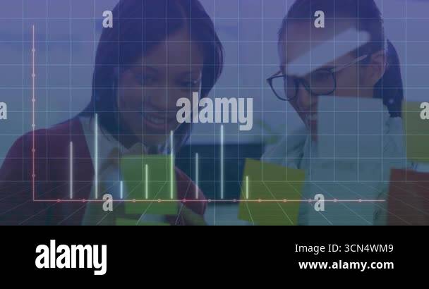 Two women analyzing business cards as grid fading in sparking bars ...