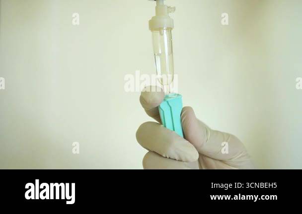 Medical personnel measuring IV drips. Set iv fluid intravenous drop ...
