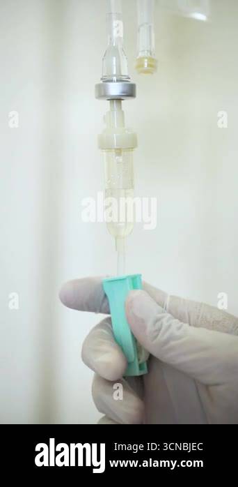 Medical personnel measuring IV drips. Set iv fluid intravenous drop ...