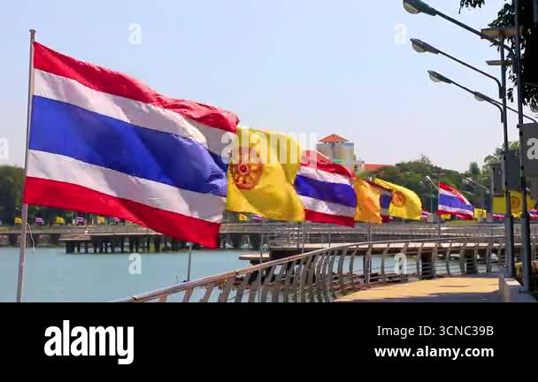 Walking path road with Thai and buddhist flag flags with blue sky in ...