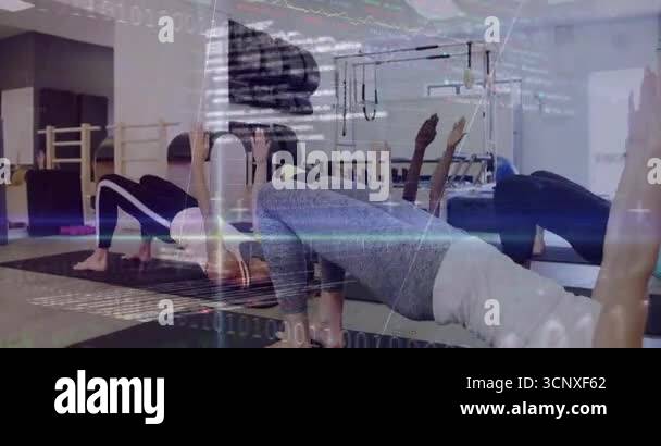 on class start six women in Pilates studio pressing arms upward ...