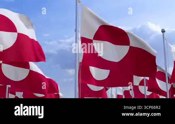 Greenland National flags waving in the wind on a clear day. Digital ...