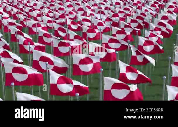 Greenland National flags waving in the wind on a clear day. Digital ...