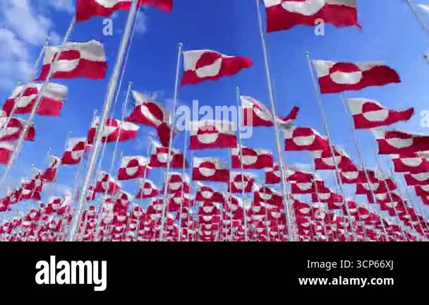 Greenland National flags waving in the wind on a clear day. Digital ...