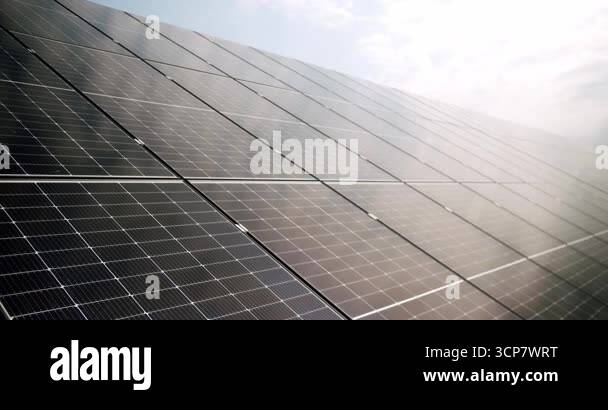 Closeup handheld shot of modern photovoltaic panels illuminated with ...