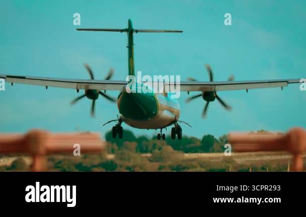 Plabe Rising Turboprop aircraft landing on runway during clear weather. Passenger ...