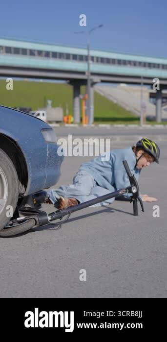 A Caucasian woman on a scooter after being hit by a car Stock Video ...