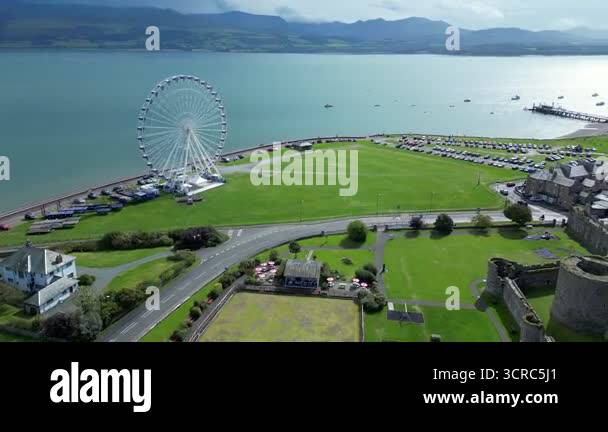 Aerial view of the Ferris Wheel and the medieval ruins of Beaumaris ...