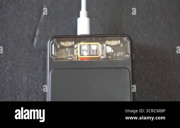 Black power bank with LED digital screen showing battery capacity while ...