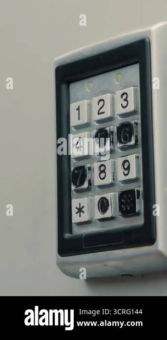 Hands pushing buttons on electronic control machine to access door ...