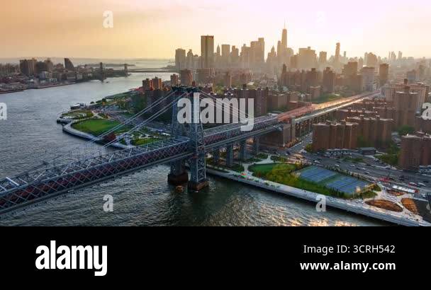 multiple-cars-run-by-and-under-the-beautiful-williamsburg-bridge-hazy