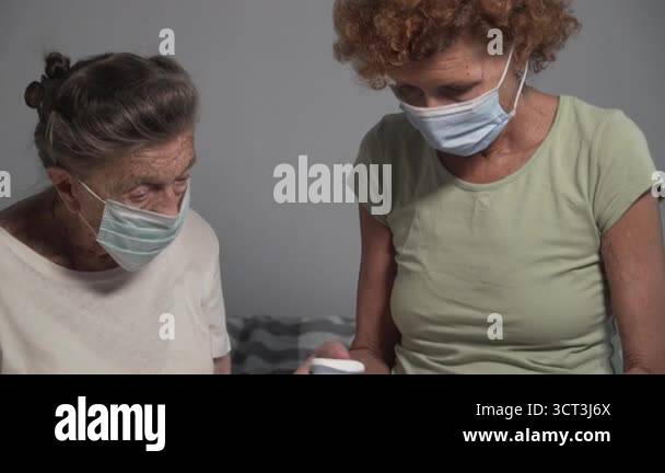 Portable Pulse Oximetry, pulse oximeter fingertip. Nurse adjusting ...