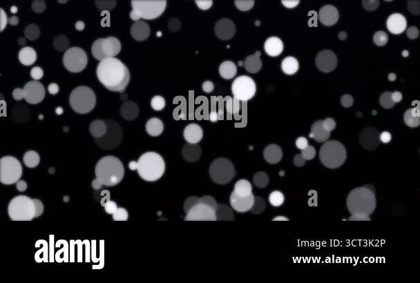 White and black particle bokeh floating in black background. Loop Stock ...