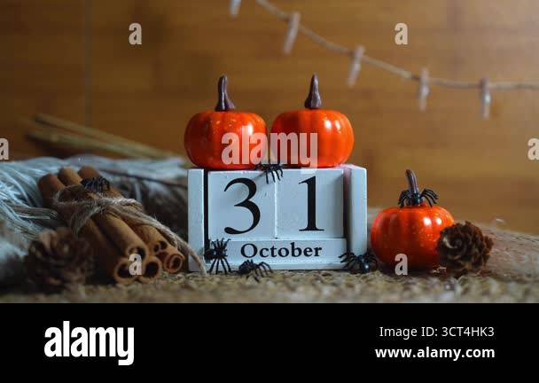 Rustic white wooden calendar showing October 31 with mini pumpkins ...
