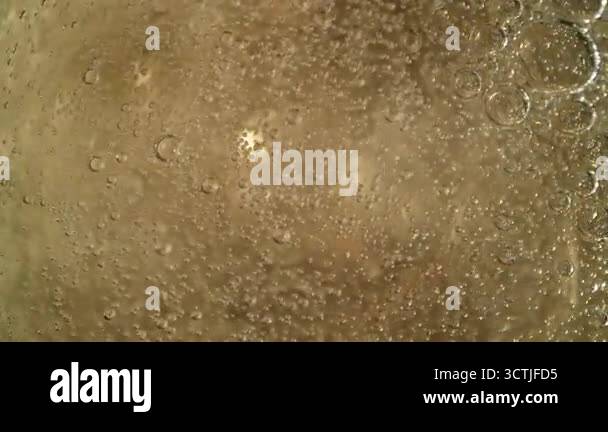 Super Slow Motion Shot of Rising Bubbles in a Fresh Sparkling Drink at ...