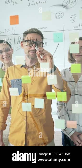 Business people team collaborating on a project, using a transparent ...