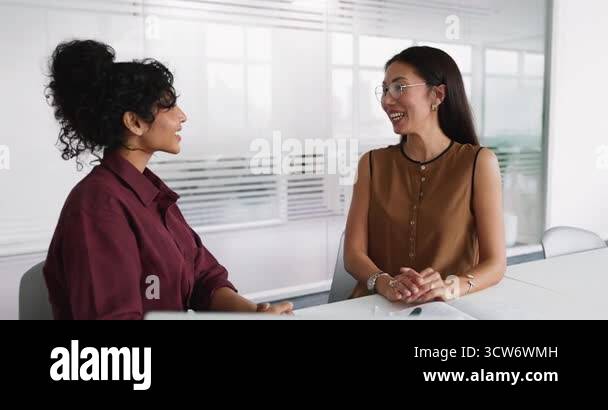 Happy young diverse business professional women shaking hands at ... - Our Consultants Bring Hands