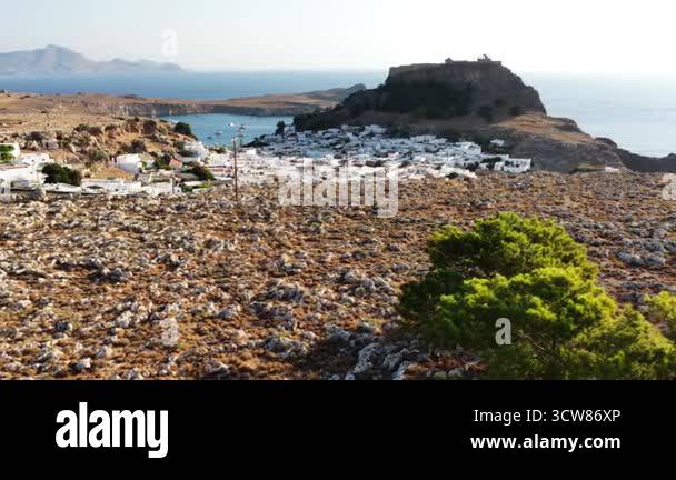 Lindos in Rodos Greece showcases its breathtaking coastline and white ...