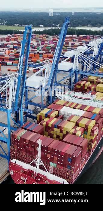 Container Cradle Loading Crane loading cargo container to container ship in the international ...