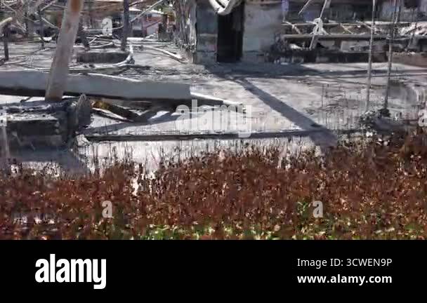 The aftermath of a devastating fire at a construction site. Burned ...