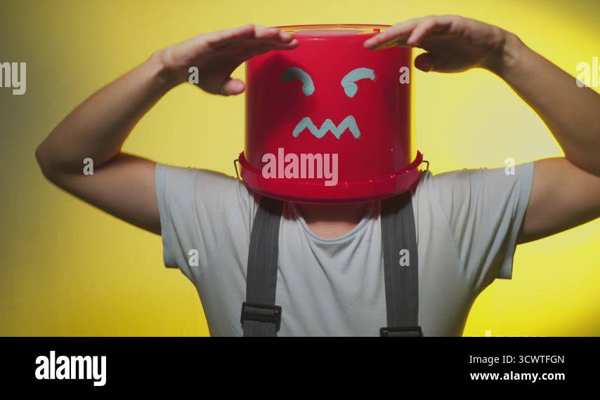 Worker in uniform with red bucket on his head angry Stock Video Footage ...