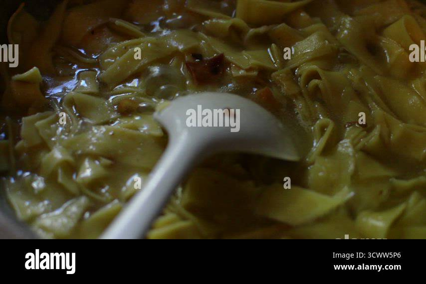 boiling water and ribbon pasta covered with steam Stock Video Footage ...