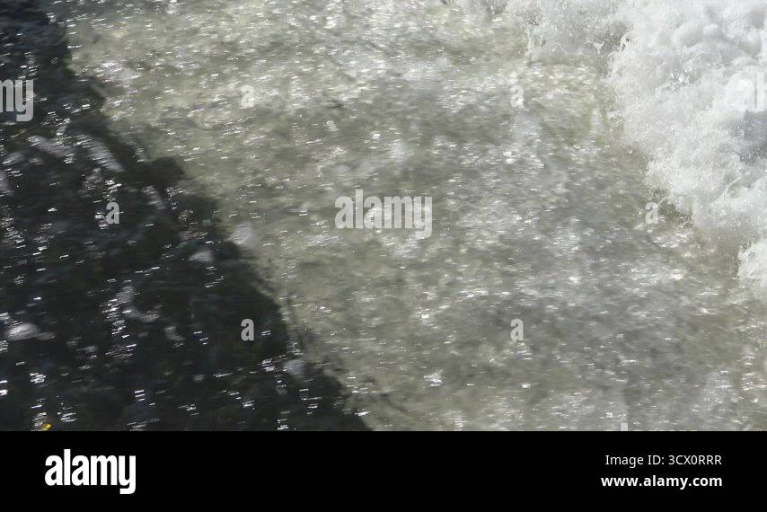 Pollution Rrr Water pollution. Dirty water from treatment plants flows through a pipe ...