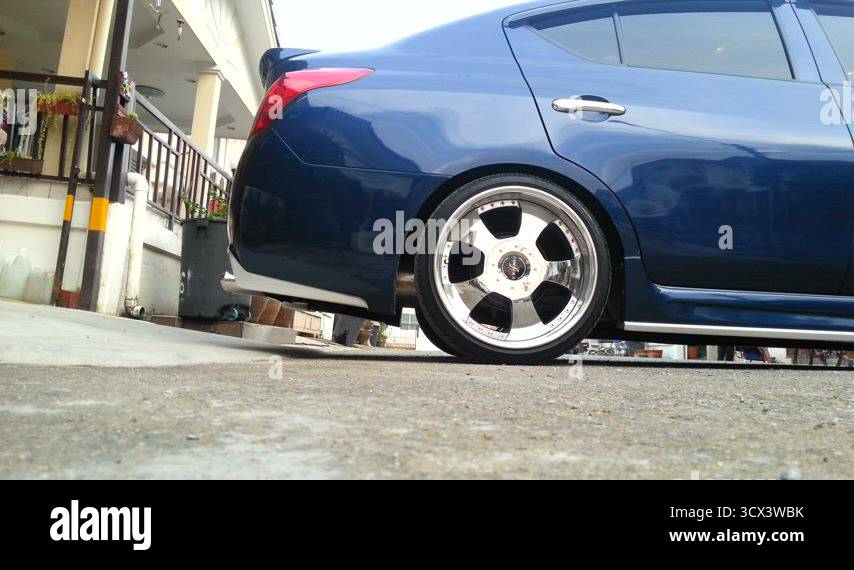 Sloping Rear Car Driving a lowered car on a sloping car park Stock Video Footage - Alamy