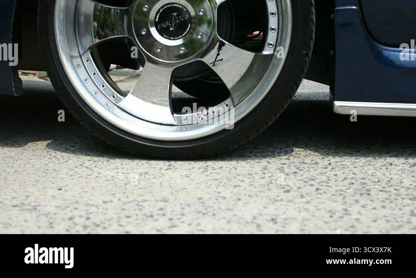 Sloping Rear Car Driving a lowered car on a sloping car park Stock Video Footage - Alamy