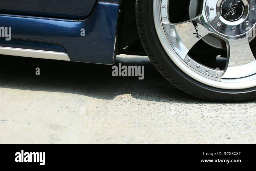 Sloping Rear Car Driving a lowered car on a sloping car park Stock Video Footage - Alamy