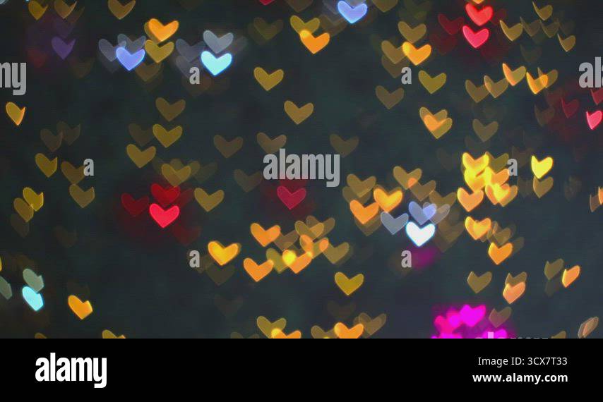 Blurred red blue orange warm shape hearts blink on tree beautiful night ...