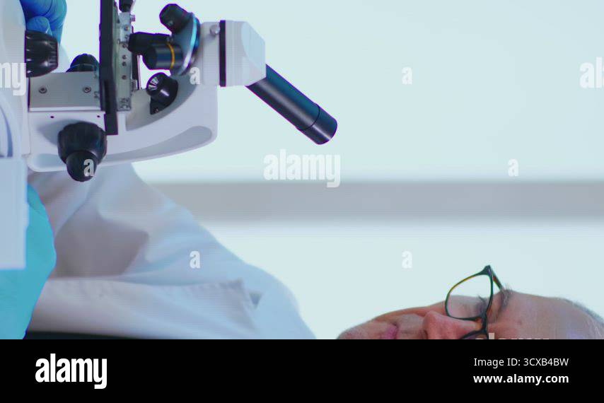 Vertical video: Senior lab technician examining samples and liquid ...