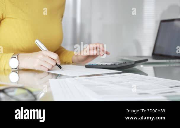 Woman managing personal finances, calculating expenses and income ...